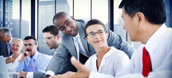 Business meeting being held in skyscraper