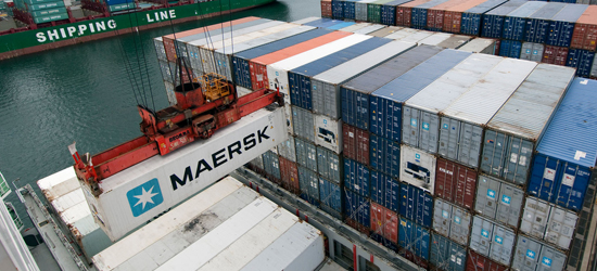 Containers being loaded cargo ships at the Port of Seattle