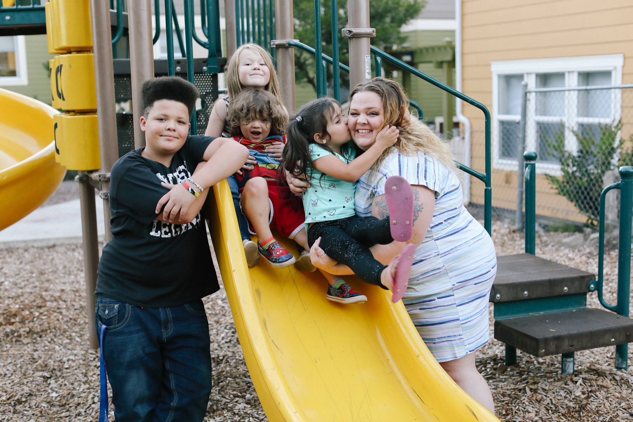 photo of young mother Stephanie Zuniga and her three children at Evergreen Visata, a Housing Trust Fund project