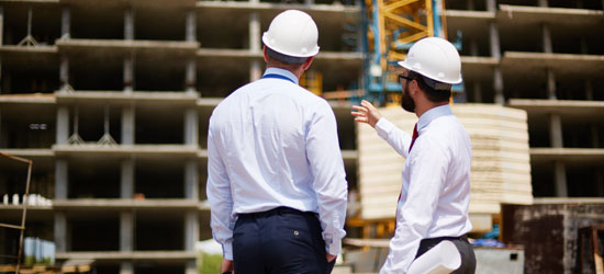 People in hardhats at build site