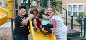 photo of young mother Stephanie Zuniga and her three children at Evergreen Visata, a Housing Trust Fund project