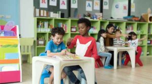 Elementary students in classroom setting sitting at desk