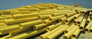 Pile of yellow construction pipes