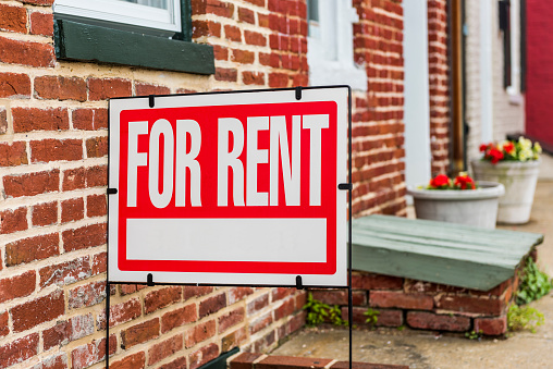 ThinkstockPhotos-700228842 Red For Rent sign closeup against brick building