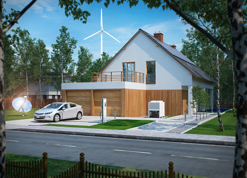 home electric car charging with solar power and wind power turbine in the background
