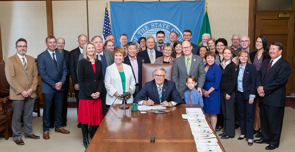 Governor Inslee signing 2SSB 5511 into law.