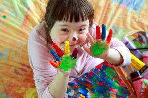Child using fingerpaints