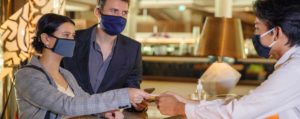 People at restaurant wearing masks during COVID-19 outbreak