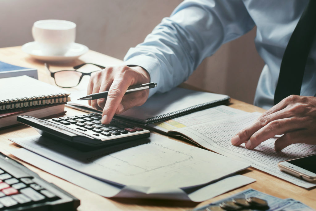 businessman using a calculator