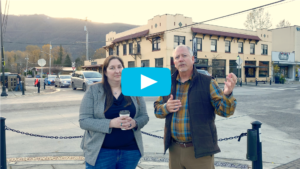 North Bend mayor and another person in video thumbnail with play button