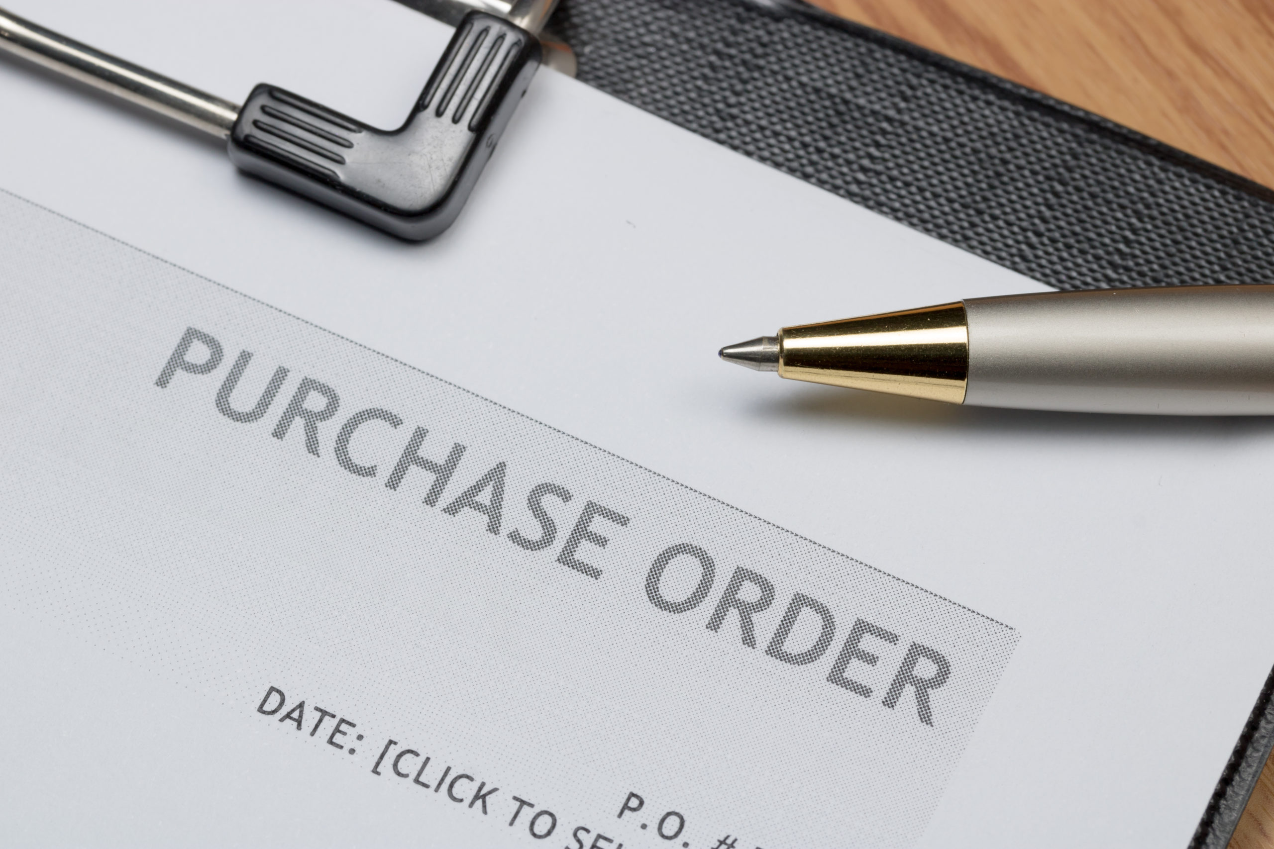 Close up of purchase order form with pen / selective focus