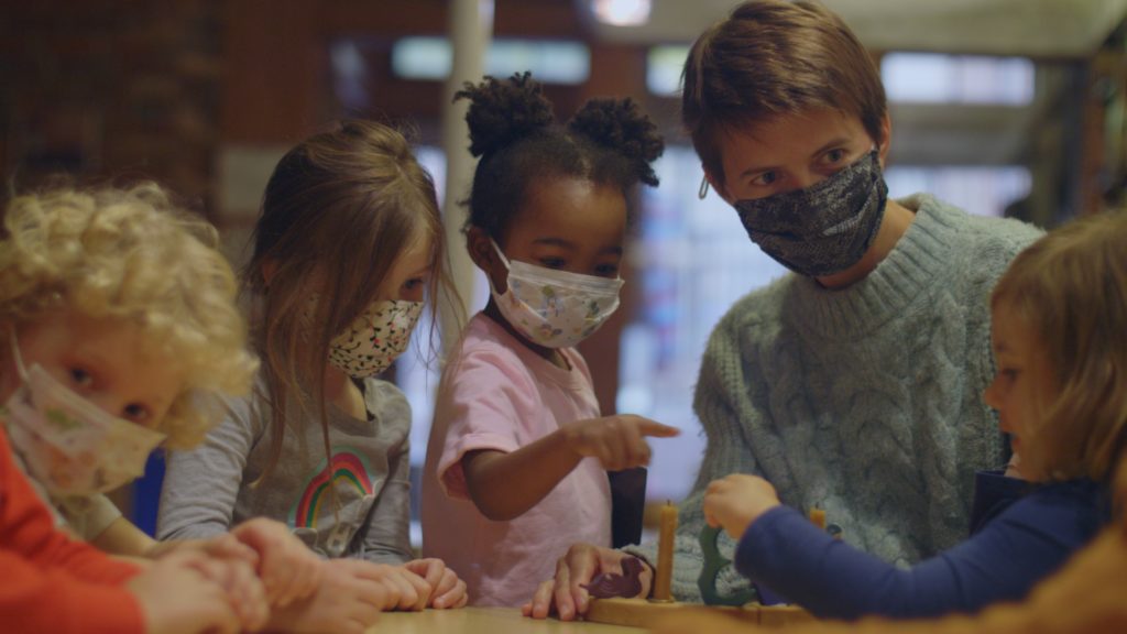 Woman working with children