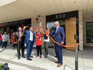 Photo of ribbon cutting at YWCA affordable housing project in seattle in June 2023