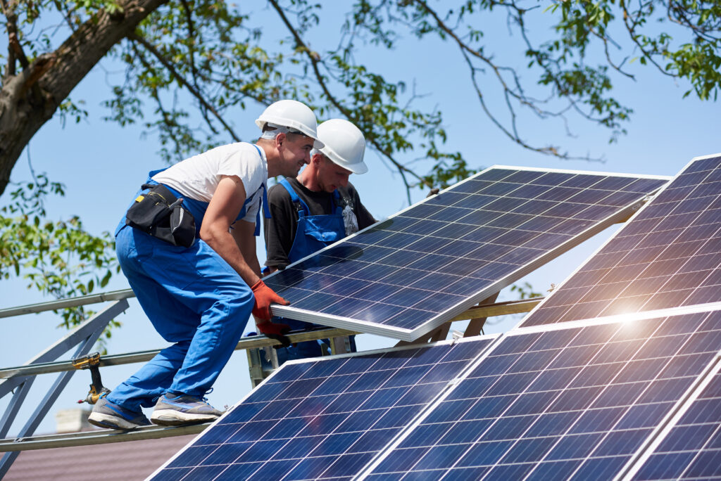 Technicians installing solar panels