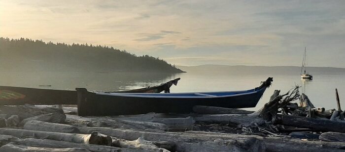 Photo of two canoes on the beach in WA.