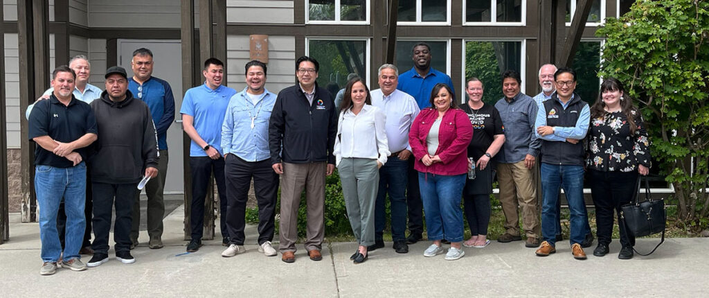 Commerce Director Mike Fong with representatives from the Spokane Tribe of Indians and Commerce employees.