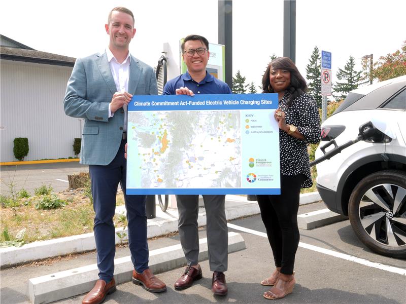 Commerce Director Joe Nguyen (center) joins Electric Era’s Kyler Schmitz and Clean & Prosperous Institute Board Member Paula Sardinas at the opening of the new EV charging station.